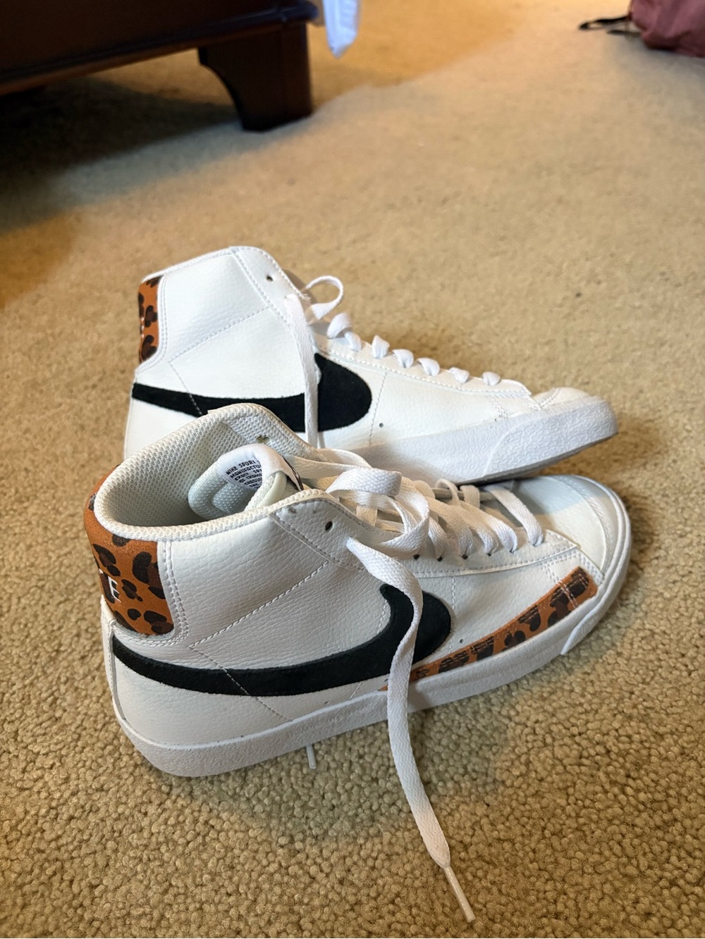 Nike White High-Top Sneakers with Black Swoosh and Leopard Trim